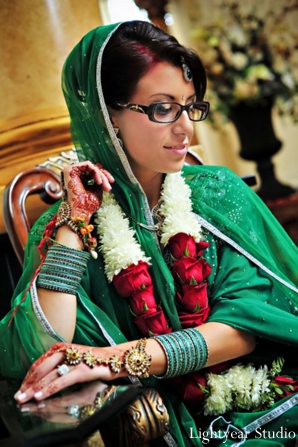 Indian bride in modern bridal lengha and indian bridal jewelry set.