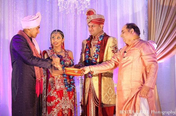 indian bride and groom at an elegant modern indian wedding ceremony.