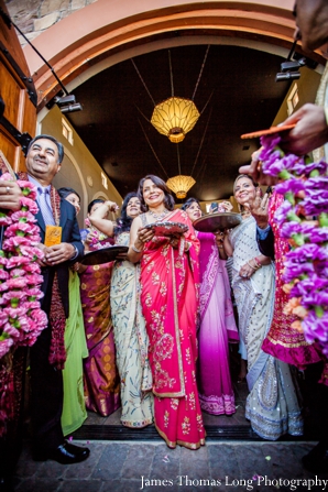 indian bride's family greets groom at indian wedding