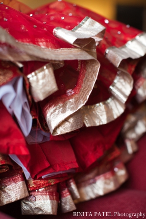Indian wedding lengha ruffles in red and gold.