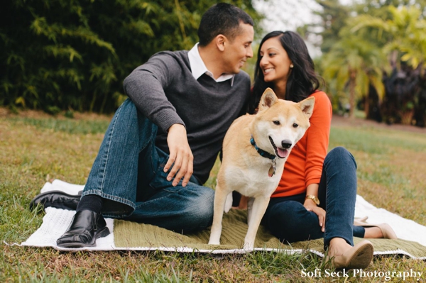 Indian bride and groom take engagement photos in the park with dog