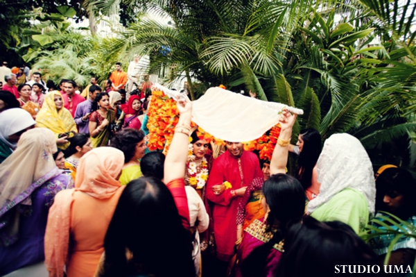 Indian bride and groom enter indian wedding ritual called haldi.