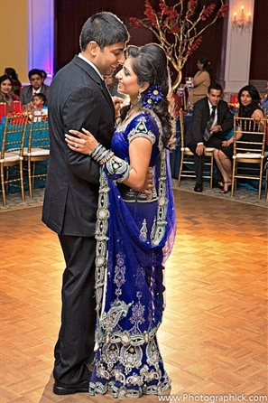 Indian bride wears royal blue indian bridal lengha. 