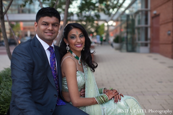 Indian bride in a green bridal lengha for Indian wedding reception.
