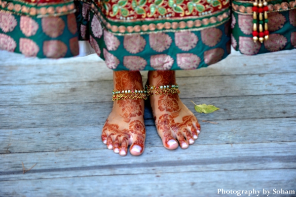 Indian bridal mehndi, or bridal henna, on feet on indian bride.