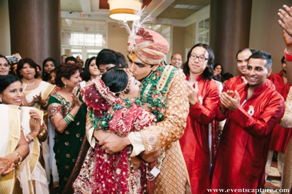 Indian bride and groom embrace before their indian wedding ceremony