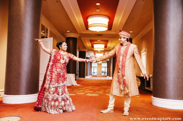 Indian bride in bright red bridal lengha.