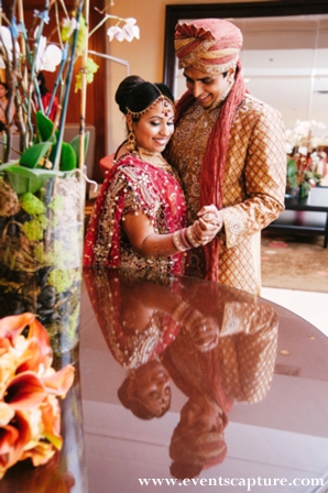 indian bride and groom portrait in traditional wedding clothes.