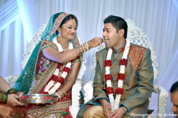 Indian bride and groom in traditional indian wedding outfits.