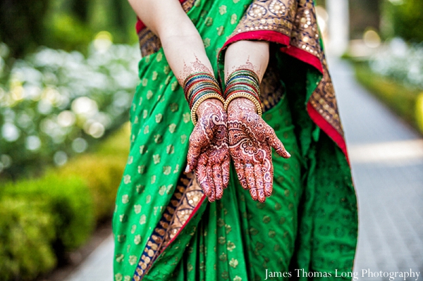 South Indian bride shows off her bridal mehndi.