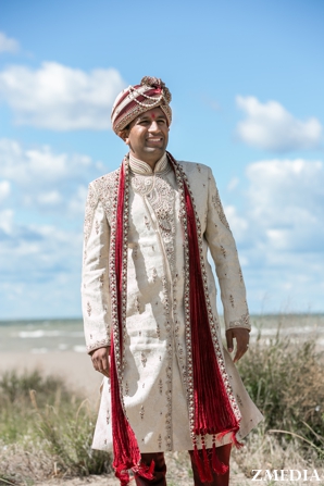 indian groom wedding portrait in traditional wedding outfit