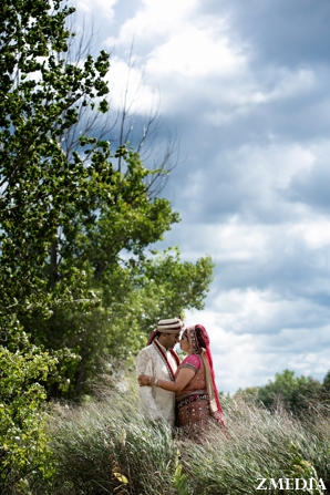 indian bride and groom wedding portrait outdoors