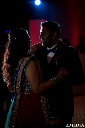 indian bride and groom dance at indian wedding reception