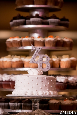 Indian wedding cake with monogram topper and cupcake tower