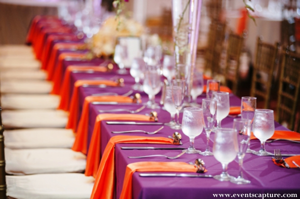 Indian wedding reception table in orange and purple