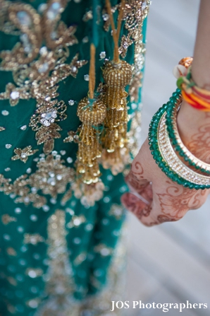indian bride wears teal wedding lengha with matching churi bracelets