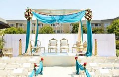 A sky blue mandap for an Indian wedding ceremony.
