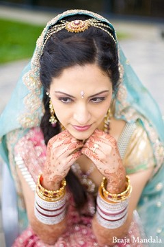An Indian bride chooses soft pastels for her wedding ceremony.
