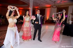 An Indian bride and groom celebrate at their wedding reception.