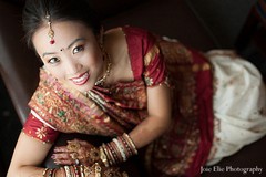 This bride prepares for her Indian wedding ceremony with beautiful hair and makeup.