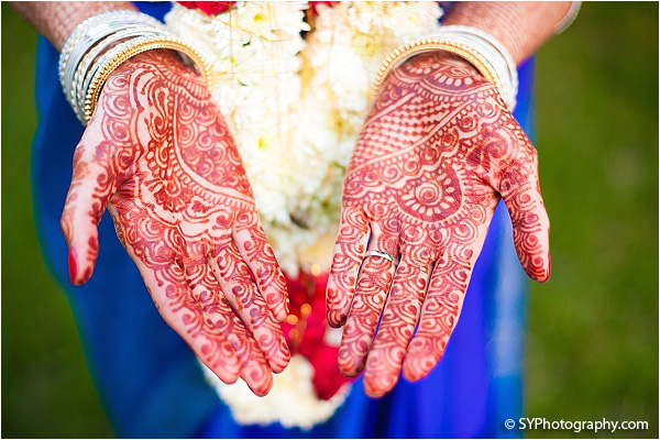 A South Indian bride shows off her bridal henna.