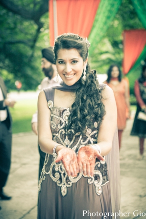 An Indian bride shows off her bridal mehndi party.