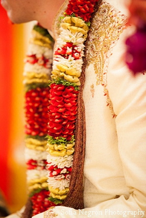 Indian groom wears jaimala at south indian wedding