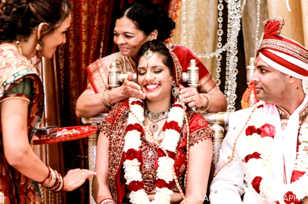 Indian bride and groom wear jaimala flower garlands at indian wedding ceremony